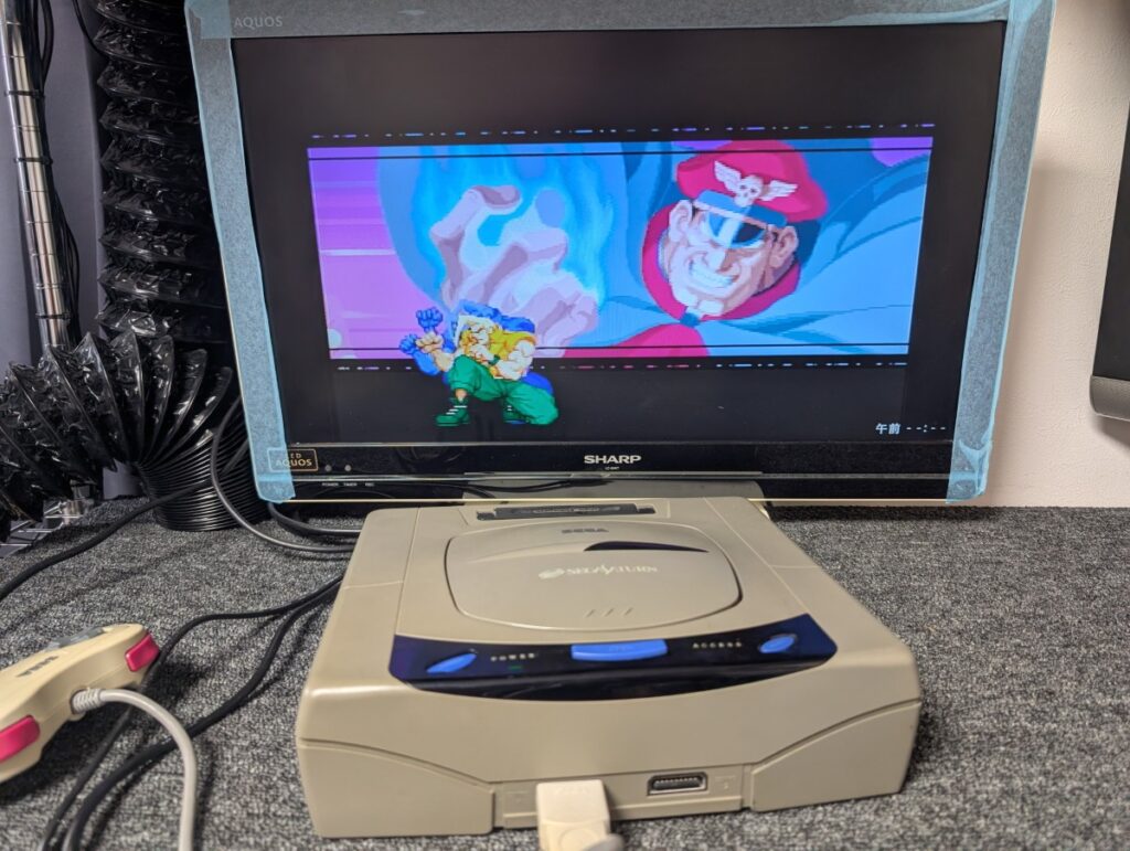 セガサターンの読み込み不良修理後の動作確認時の写真

本体とゲームタイトルが表示されたテレビ画面